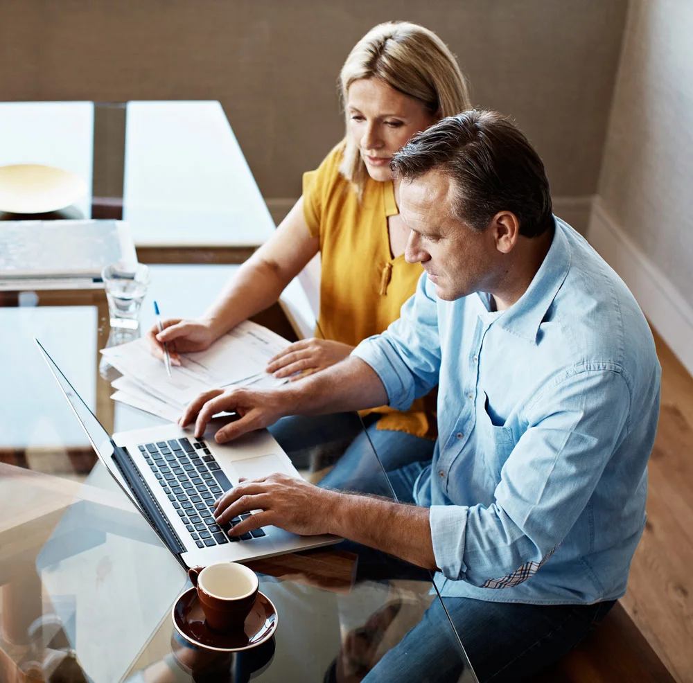 Couple reviewing plan with advisor